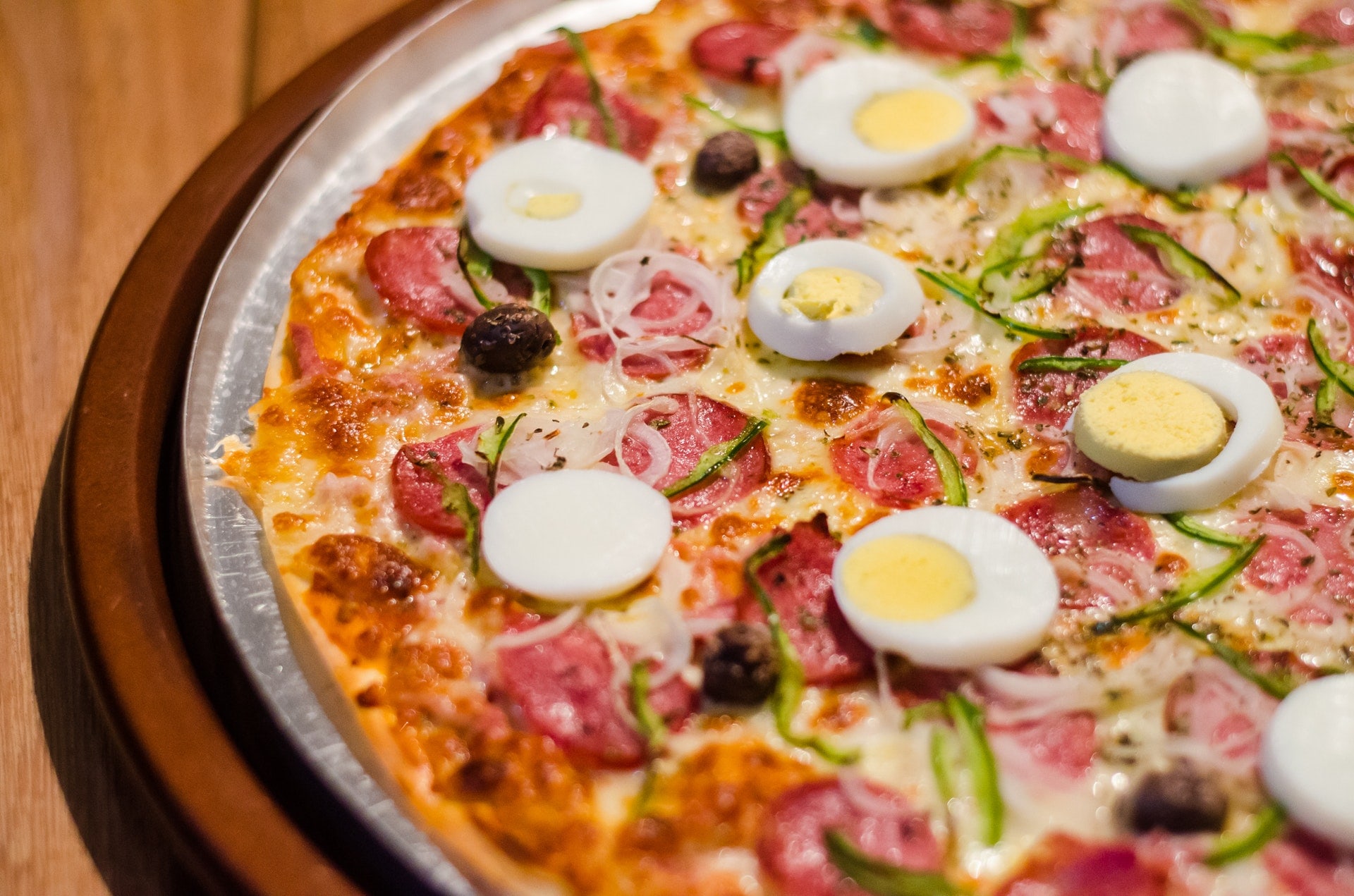 Pizza with eggs and pepperoni